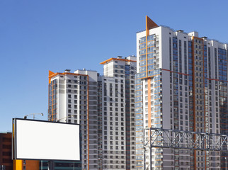 Billboard on the background of the residential high-rise building