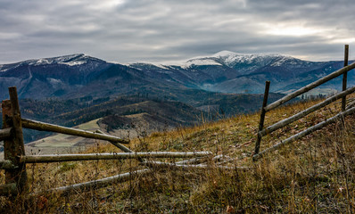 fence on rural field in late autumn