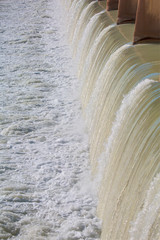 Strong stream of water at the hydroelectric dam