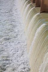 Cercles muraux Barrage Strong stream of water at the hydroelectric dam