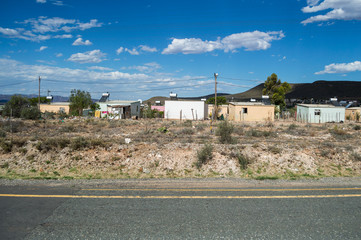 Fototapeta premium Township with Mountain Backdrop and Highway, Western Cape, South Africa