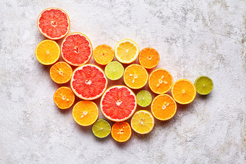 Citrus fruits flat lay on white background table, healthy vegetarian organic food, antioxidant...