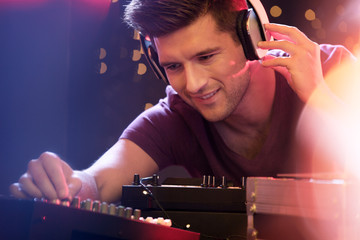 Man mixing music on turntable