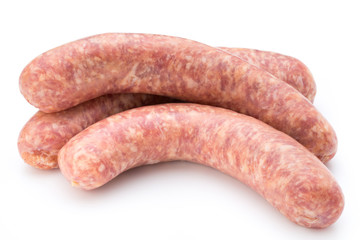 Raw sausage with parsley leaf isolated on white background.