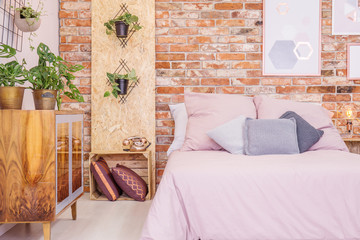 Wooden and brick bedroom