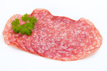 Salami smoked sausage slices isolated on white background cutout.