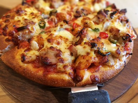 cut delicious fresh pizza