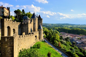 Ancient castle of Carcassonne overlooking the southern France countryside - obrazy, fototapety, plakaty