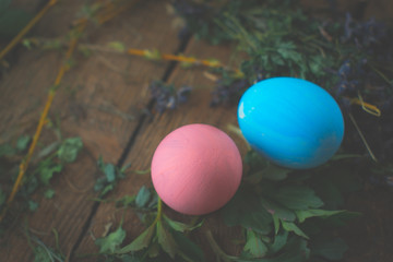 Colored easter eggs on wooden background.
