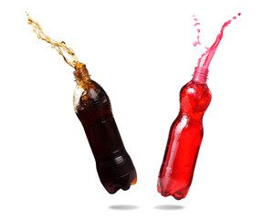 Couple cola and red soda splashing out of bottle Isolated on white background.