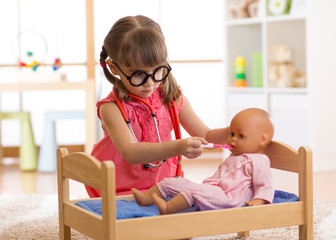 child playing doctor with toy