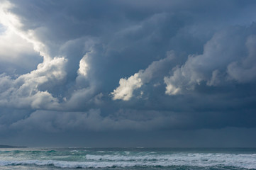 Landscape with ocean and cloudy sky