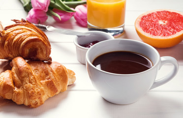 Tasty breakfast on the white table close-up