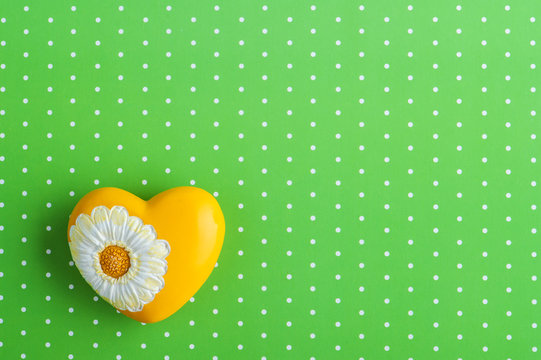 Yellow Heart On Green Polka Dot Background