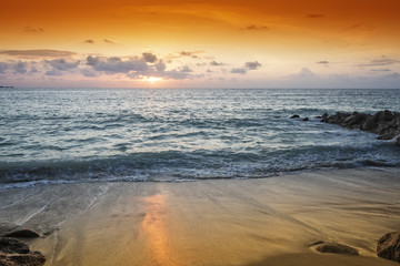 Golden sunset over tropical beach