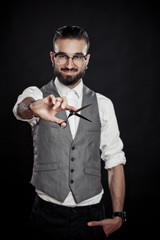 stylish hairdressers in the studio with scissors and comb