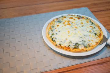 cheese and spinach pizza italian foods on wood background