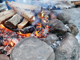 Burning woods to fuel the fire in winter.