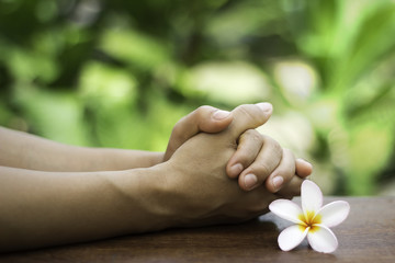 The praying hands on the table