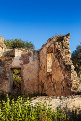 Stone walls of ruined ancient farmhouse