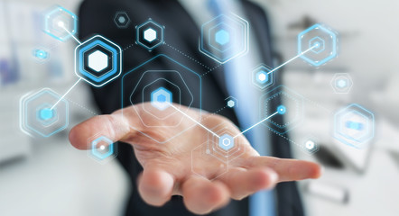 Businessman using digital screens with holograms datas 3D rendering