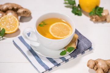 Healthy ginger tea ingredients on a wooden table