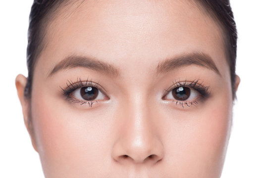 Eyes. Closeup of beautiful asian woman with brown eyes make up eye shadow