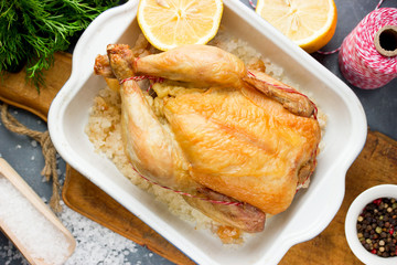 Grilled chicken on sea salt with lemon