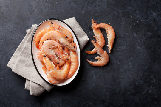Fresh seafood on stone table. Shrimps