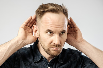 Portrait of young man gesturing