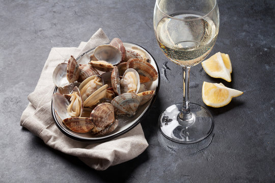 Fresh seafood bowl on stone table. Scallops