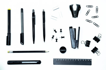 Black pen, pencil, ruler, stapler, stationery knife, paper clips, clamps, sharpener, corrector and...
