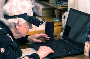 Grandmother learns to work at home on the computer