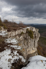 Fototapeta na wymiar Winter landscape off the cliff of Chufut Kale plateau, Crimea