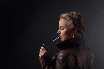 Obraz premium Portrait of young beautiful woman in brown leather coat