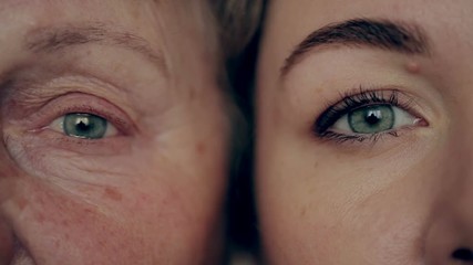 Old and young eye. Granddaughter and grandmother face to face.