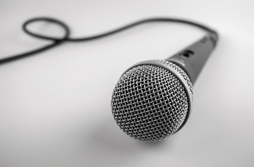 Microphone with a wire isolated on white background.