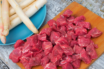 White asparagus on the colorful bread.