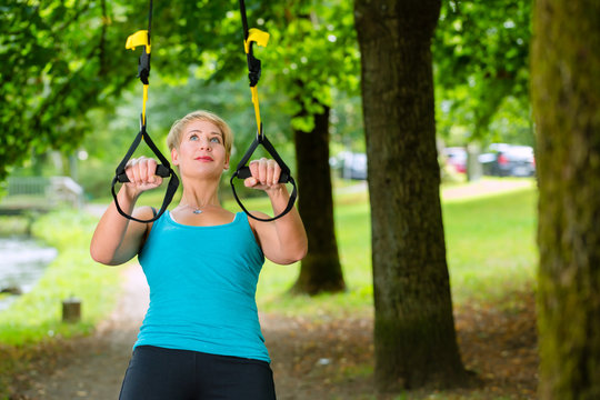 Woman Doing Suspension Sling Trainer Sport