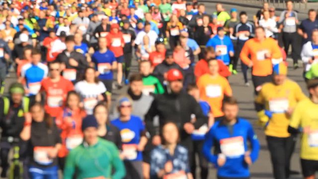 Blurred mass people of marathon runners