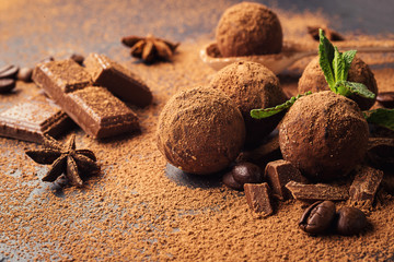 Chocolate truffle,Truffle chocolate candies with cocoa powder.Homemade fresh energy balls with chocolate.Gourmet assorted truffles made by chocolatier.Chunks of chocolate and coffee beans