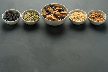 Healthy food. Multi grain flakes with blueberry, nuts for breakfast.