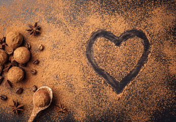 Chocolate truffle,Truffle chocolate candies with cocoa powder.Homemade fresh energy balls with chocolate.Gourmet assorted truffles made by chocolatier.Chunks of chocolate and coffee beans