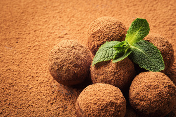 Chocolate truffle,Truffle chocolate candies with cocoa powder.Homemade fresh energy balls with chocolate.Gourmet assorted truffles made by chocolatier.Chunks of chocolate and coffee beans