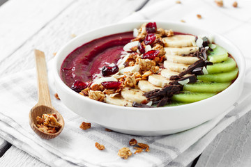 Cherry smoothie bowl with fruits and granola