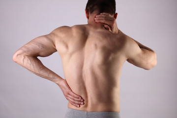 Sport injury, Man with back, neck pain. Pain relief and health care concept.