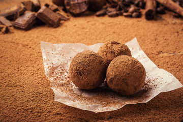 Chocolate truffle,Truffle chocolate candies with cocoa powder.Homemade fresh energy balls with chocolate.Gourmet assorted truffles made by chocolatier.Chunks of chocolate and coffee beans