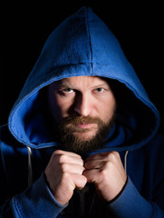 Portrait of a fighter in a hood