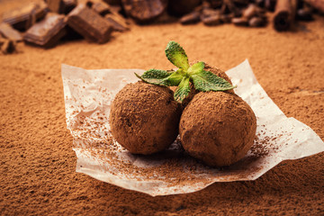 Chocolate truffle,Truffle chocolate candies with cocoa powder.Homemade fresh energy balls with chocolate.Gourmet assorted truffles made by chocolatier.Chunks of chocolate and coffee beans