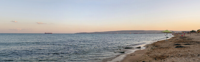 Sandy beach sunset panoramic view on the black sea